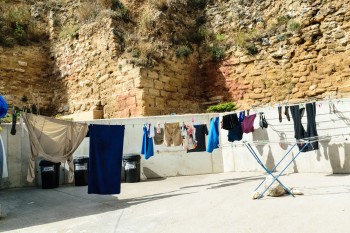 Our clothes, hanging next to a remnant of the city wall dating back to the late 11th century